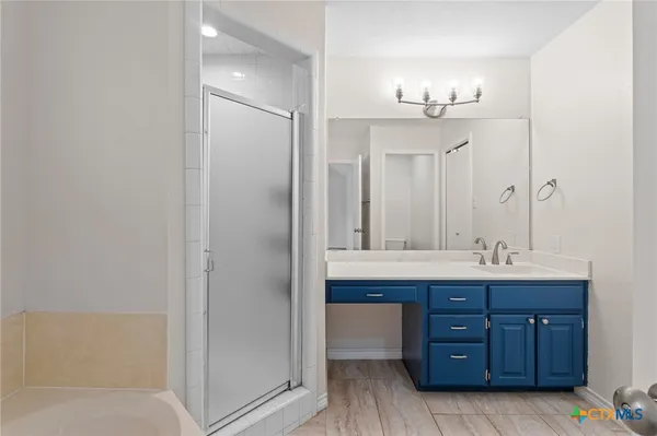 a kitchen with stainless steel appliances granite countertop a refrigerator stove and microwave
