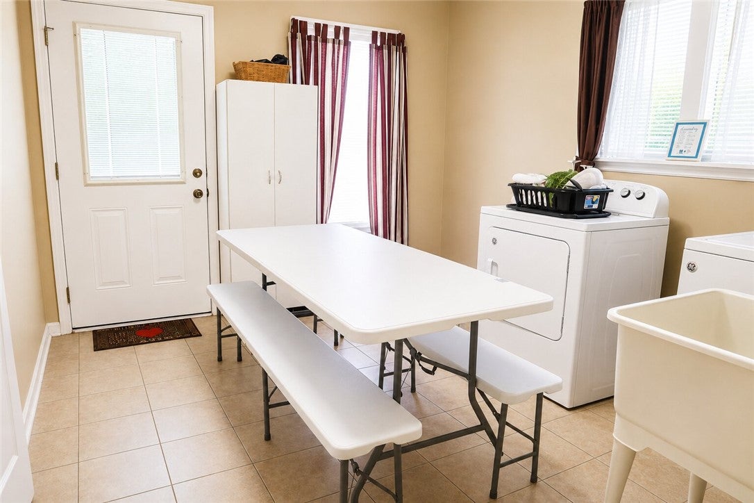 1075 Lowe Road Notasulga, AL 36866 - Photo 7 of 16 This functional space offers dedicated laundry facilities for effortless home management.