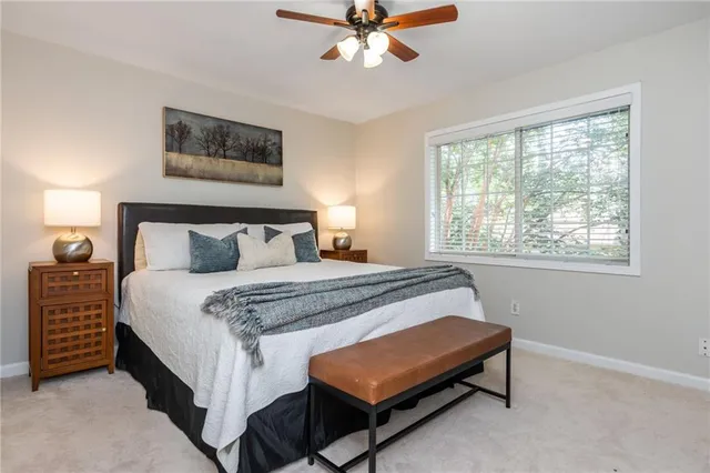 a bedroom with a bed and window