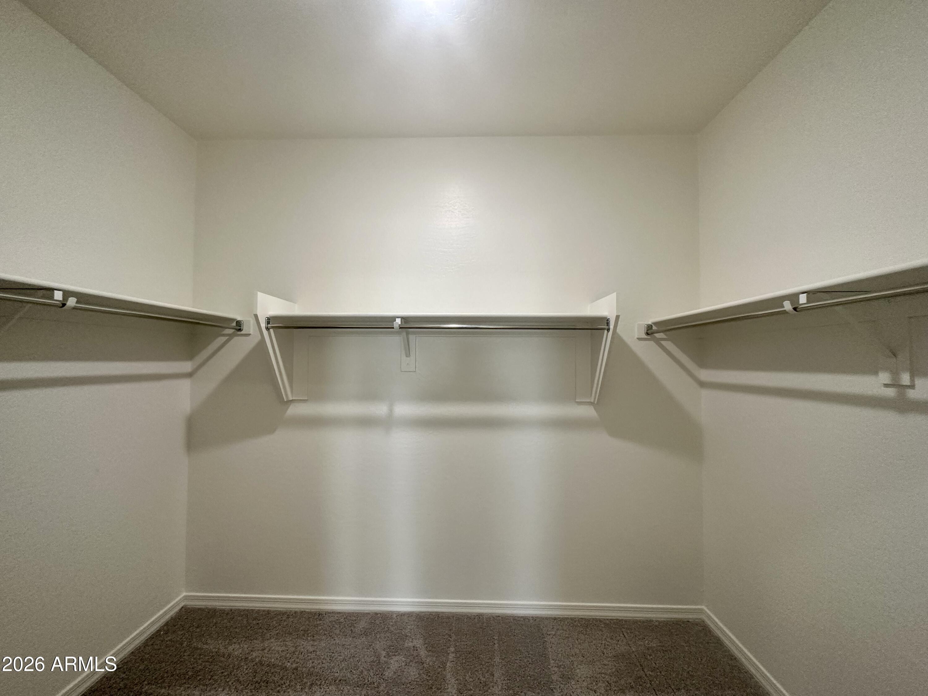 25767 North Boreas Road Florence, AZ 85132 - Photo 10 of 12 a view of an empty walk in closet