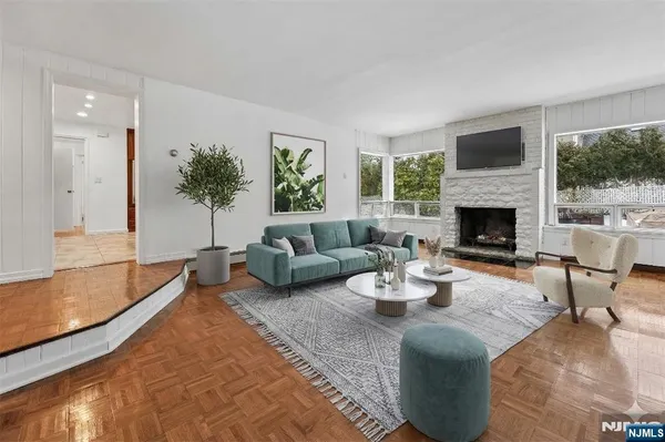 a living room with furniture and a fireplace