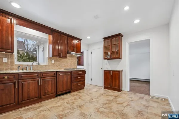 a large bathroom with a sink and a large mirror