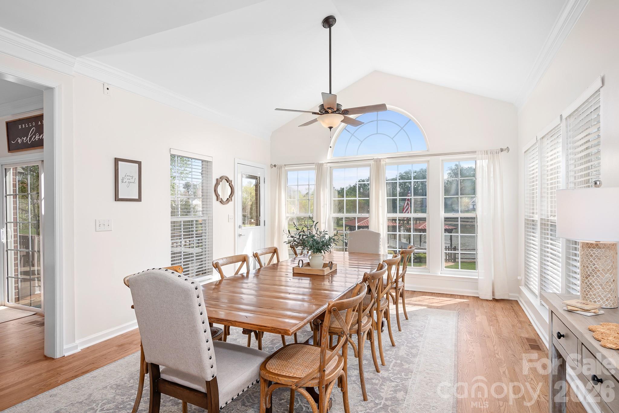 220 Chandeleur Drive Mooresville, NC 28117 - Photo 11 of 38 a view of a dining room with furniture window and wooden floor