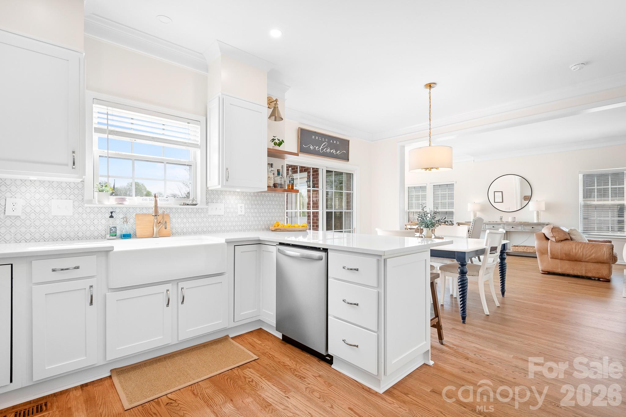 220 Chandeleur Drive Mooresville, NC 28117 - Photo 13 of 38 a kitchen with sink cabinets and window