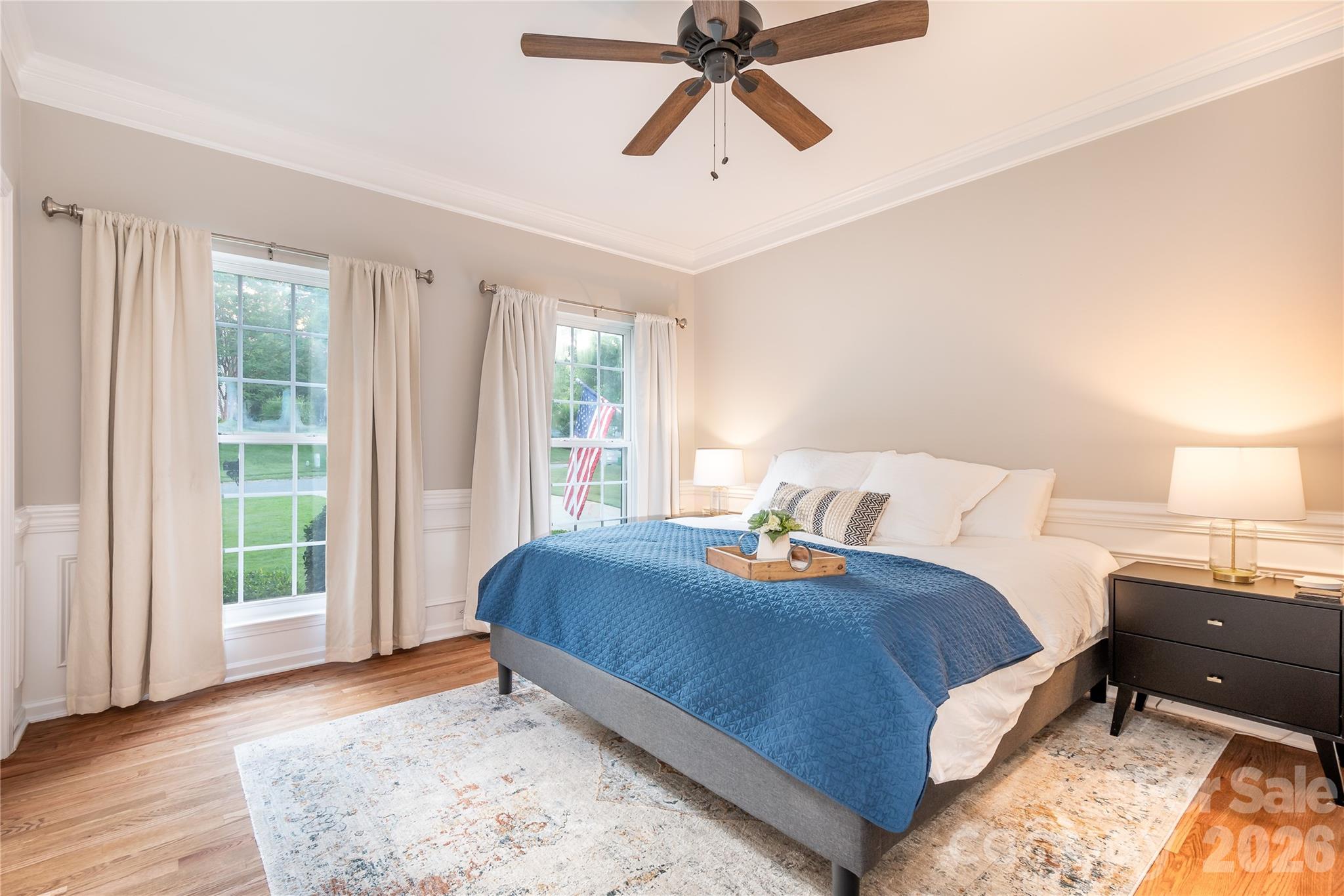 220 Chandeleur Drive Mooresville, NC 28117 - Photo 17 of 38 a bedroom with a bed and wooden floor