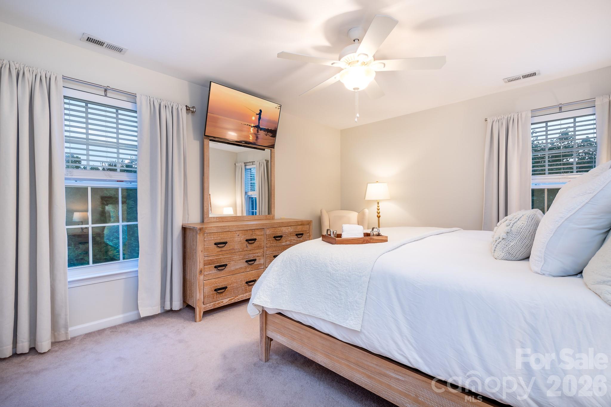 220 Chandeleur Drive Mooresville, NC 28117 - Photo 21 of 38 a bedroom with a bed and a window