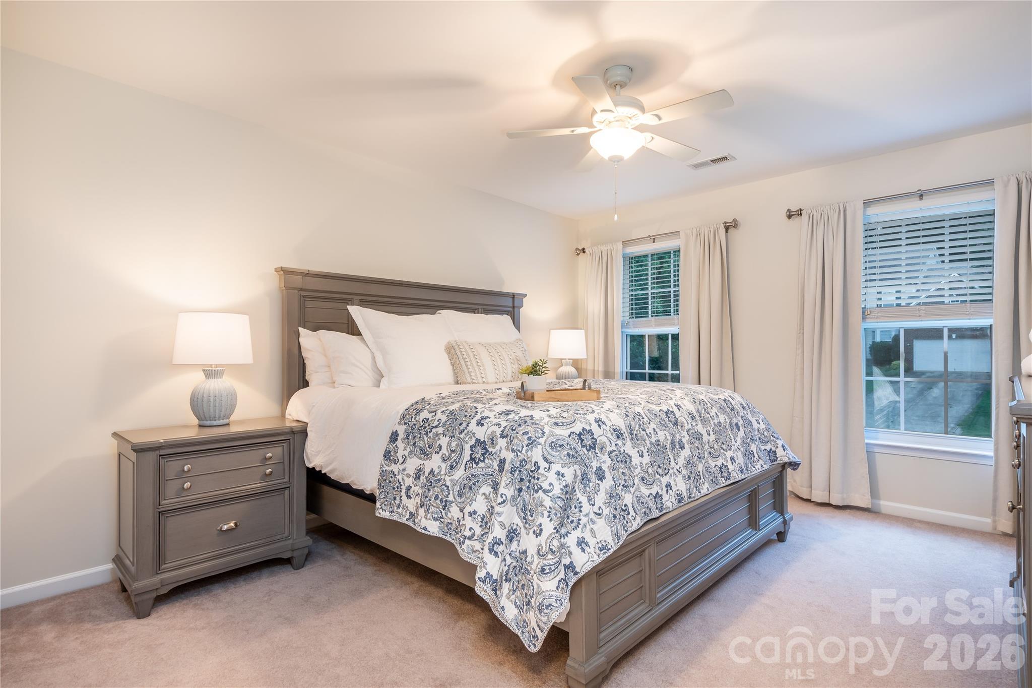 220 Chandeleur Drive Mooresville, NC 28117 - Photo 22 of 38 a bed sitting in a bedroom next to a window