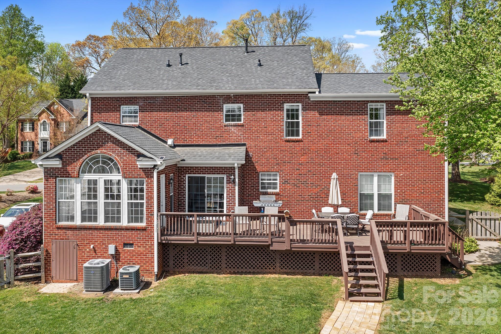 220 Chandeleur Drive Mooresville, NC 28117 - Photo 30 of 38 a front view of a house with a yard table and chairs
