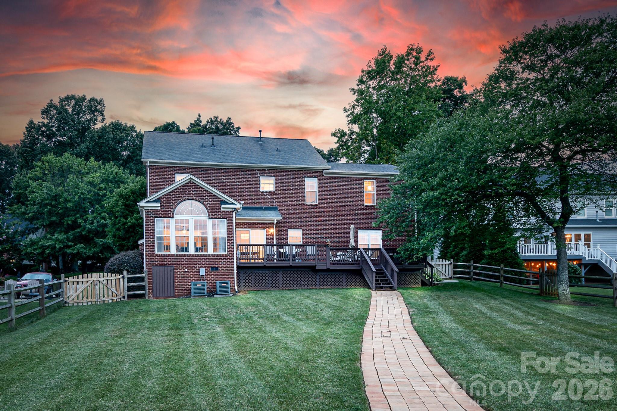 220 Chandeleur Drive Mooresville, NC 28117 - Photo 4 of 38 a front view of a house with a garden and plants