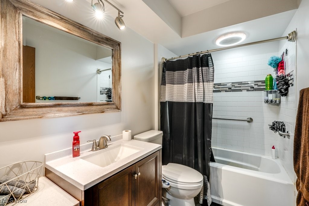3066 Prior Road Akron, OH 44319 - Photo 19 of 50 Full bathroom featuring shower / bathtub combination with curtain, toilet, and vanity