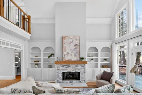 a kitchen with stainless steel appliances a dining table chairs stove and refrigerator