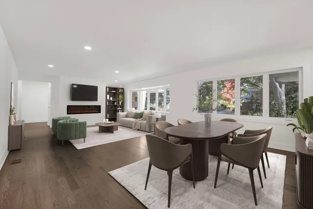 a view of a livingroom with furniture and a large window