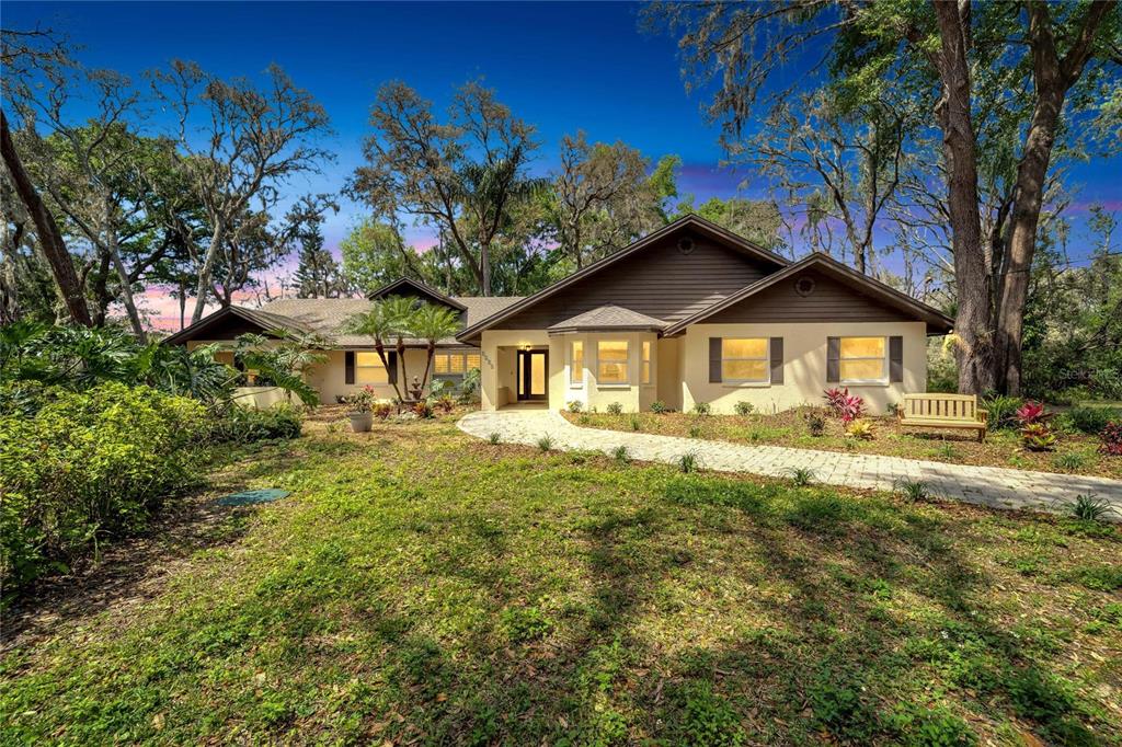 a front view of a house with garden