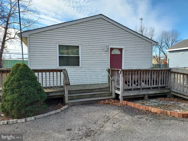 a view of a house with a yard and wooden floor