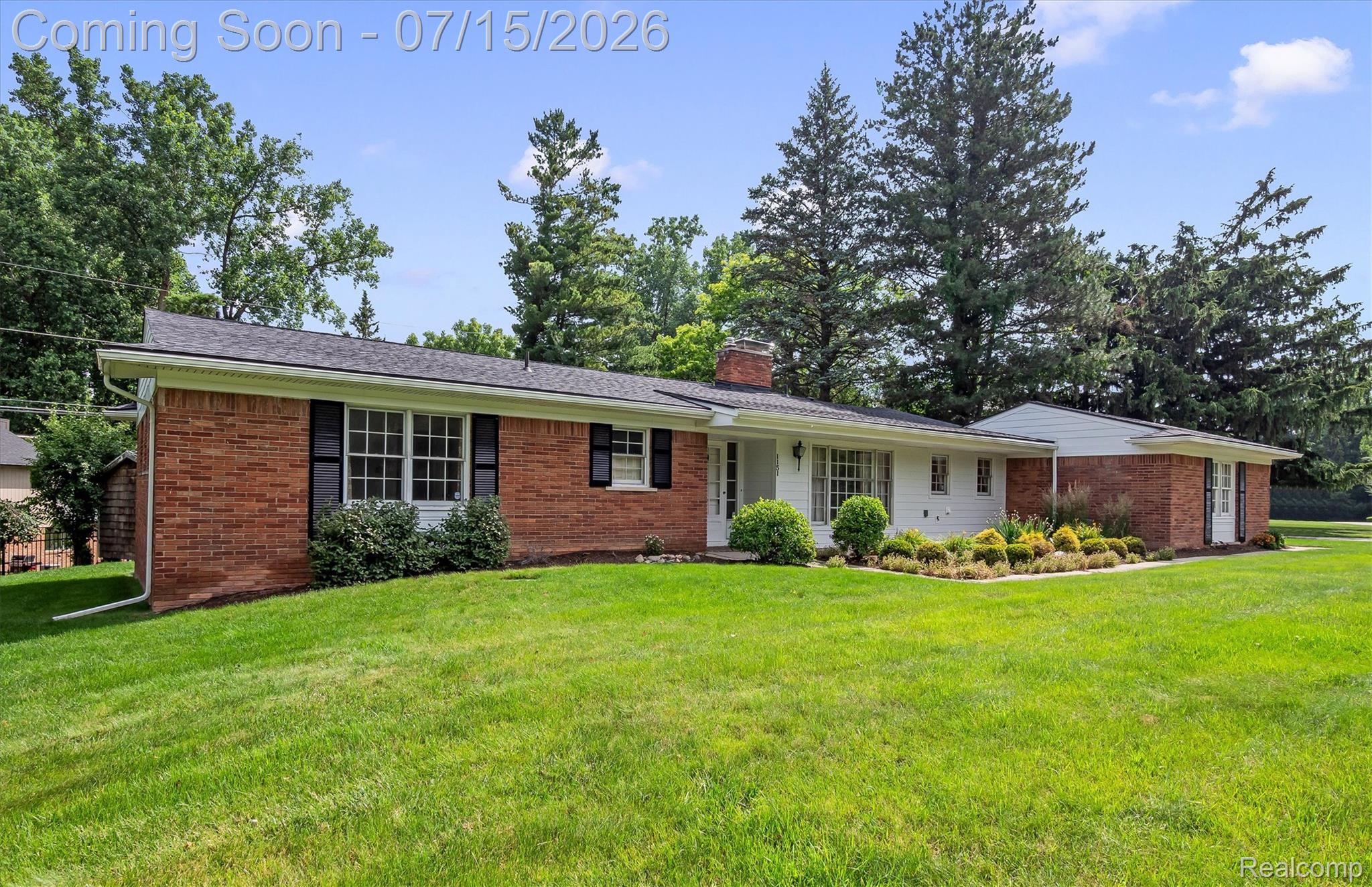 1151 Peveril Road Bloomfield Hills, MI 48304 - Photo 2 of 39 A 2000+ sq ft ranch featuring rich red brick and white siding exterior, dark shutters, and a well-maintained lawn