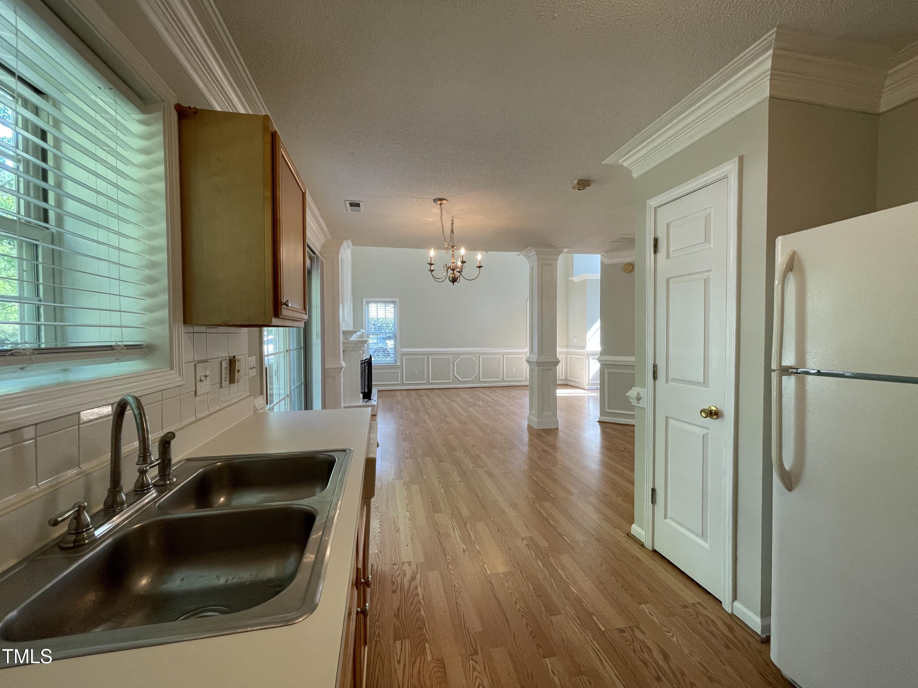 300 Firefly Road Holly Springs, NC 27540 - Photo 11 of 23 a bathroom with a sink and a large mirror