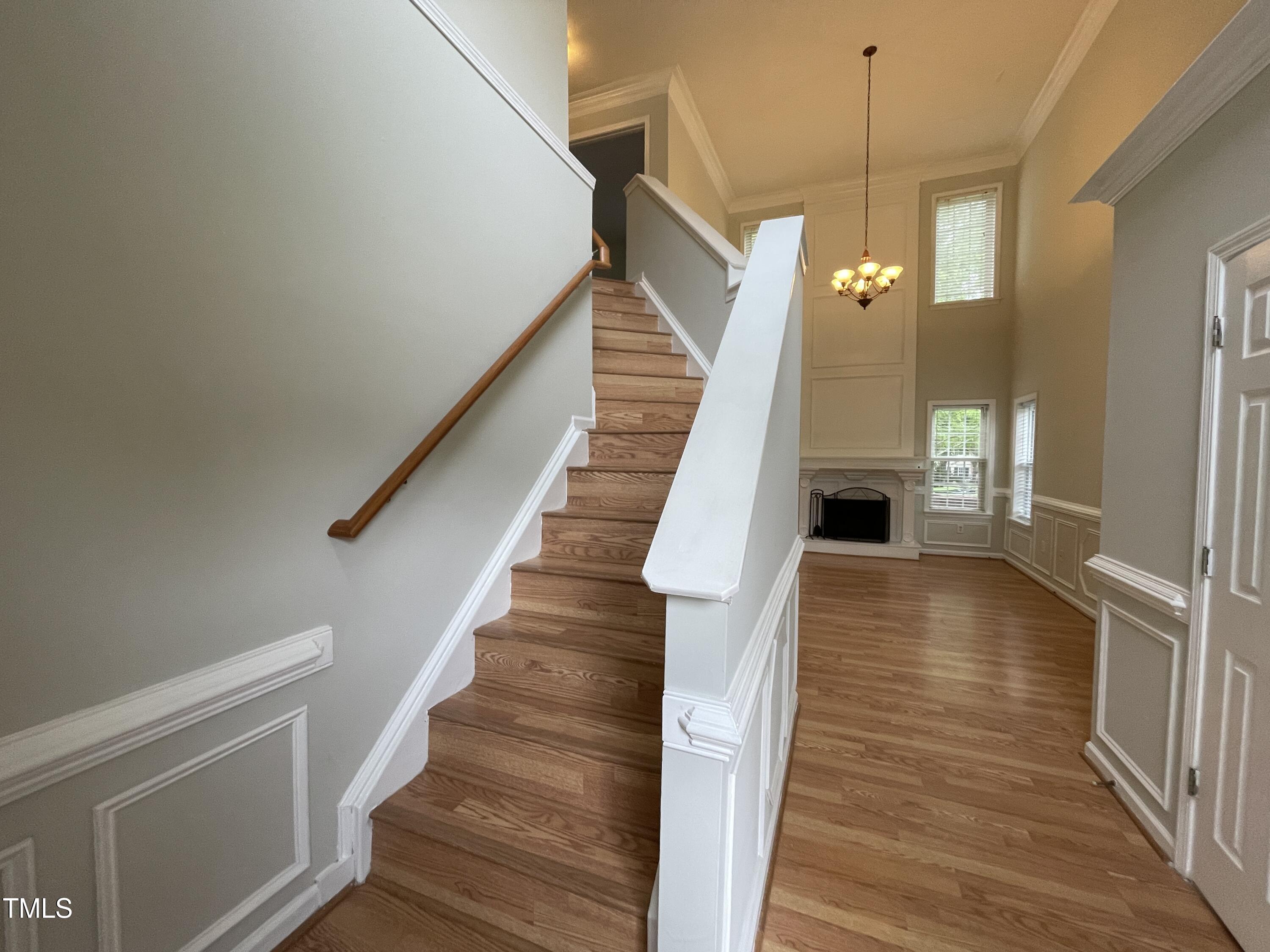 300 Firefly Road Holly Springs, NC 27540 - Photo 15 of 23 a view of entryway and hall with wooden floor