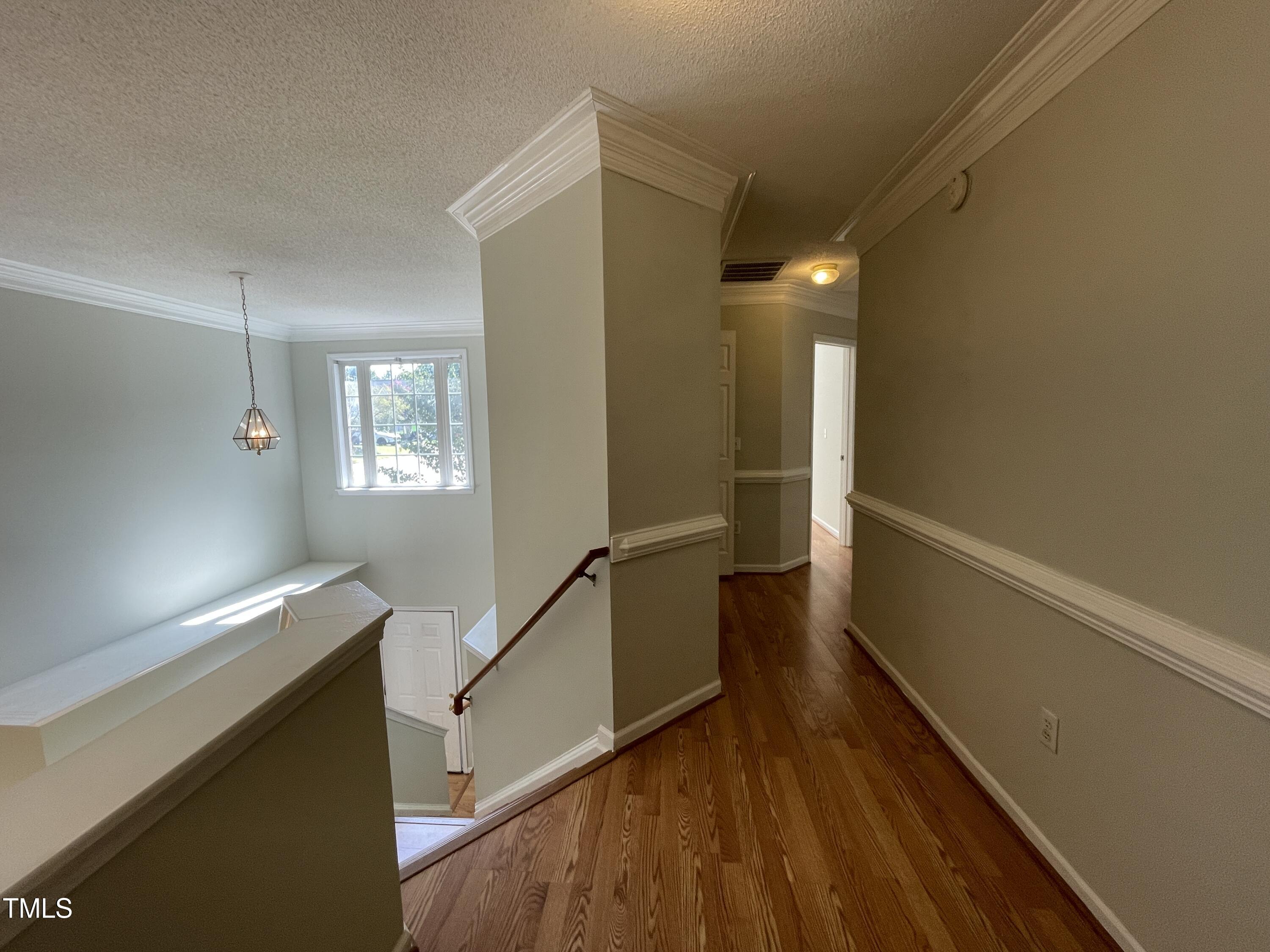 300 Firefly Road Holly Springs, NC 27540 - Photo 16 of 23 a view of entryway and hall with wooden floor