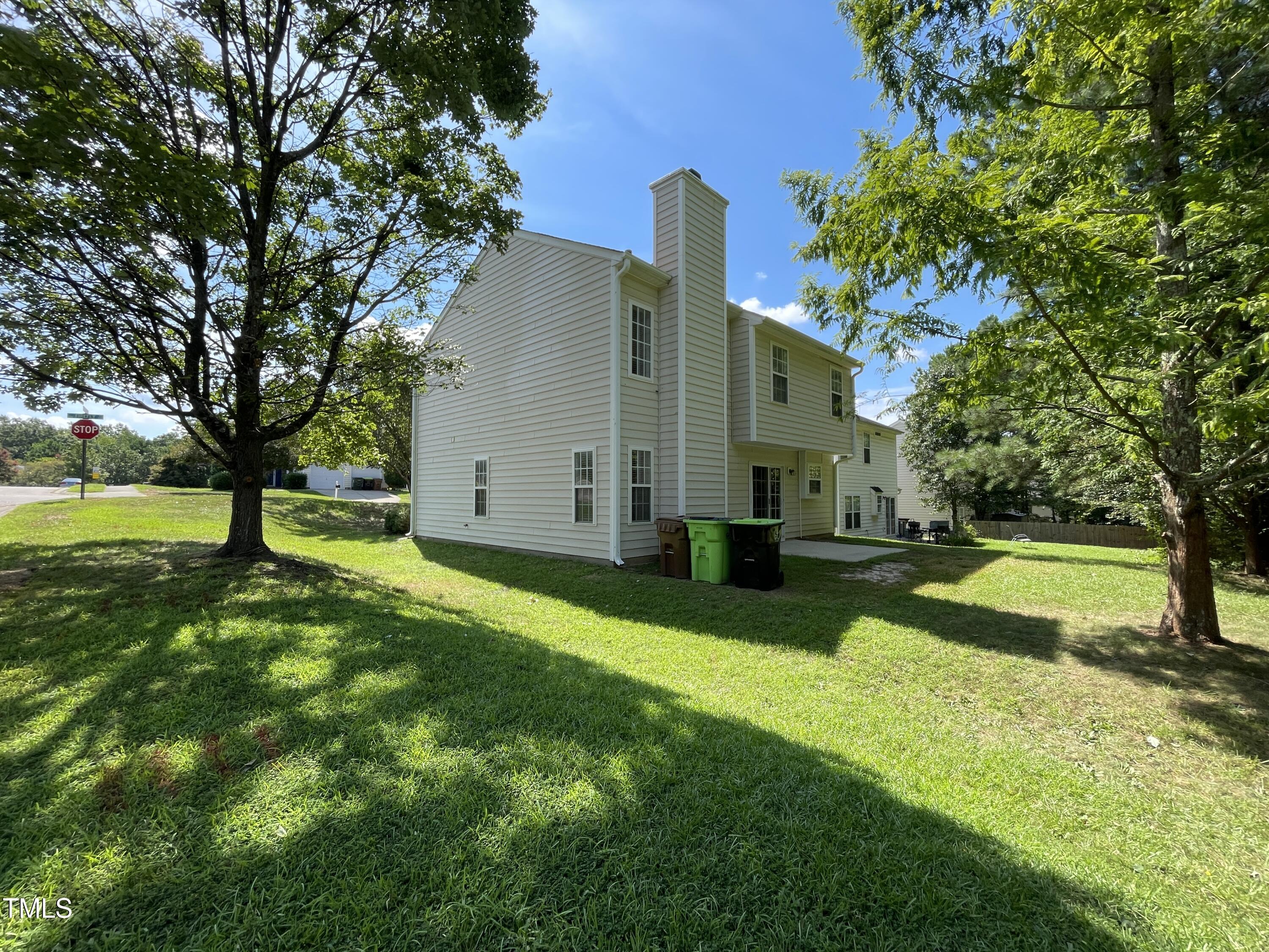 300 Firefly Road Holly Springs, NC 27540 - Photo 4 of 23 a view of a house with a backyard
