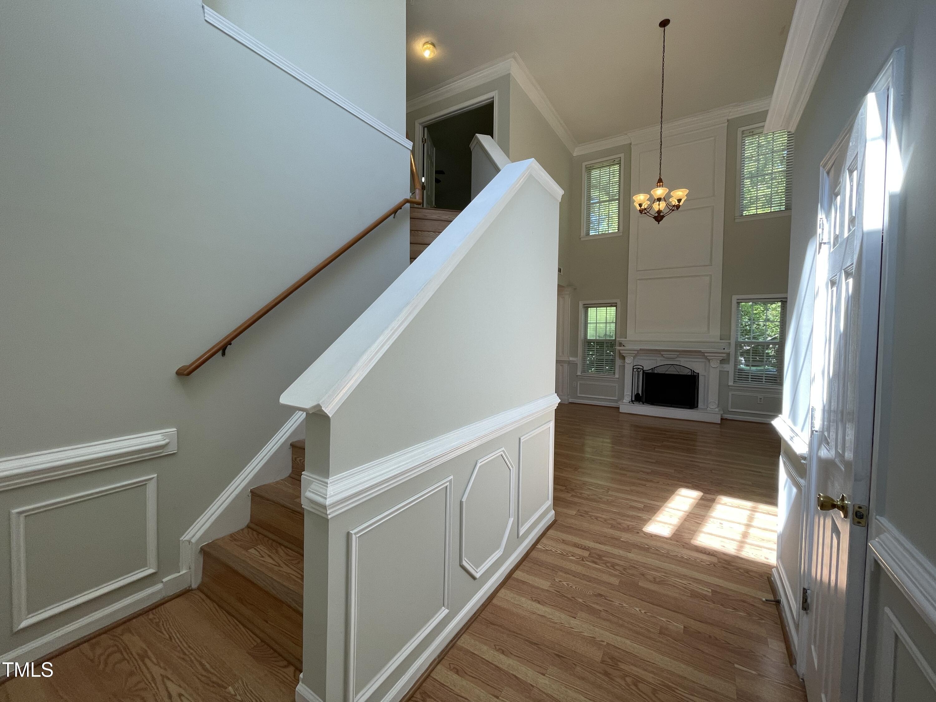 300 Firefly Road Holly Springs, NC 27540 - Photo 6 of 23 a view of entryway and hall with wooden floor