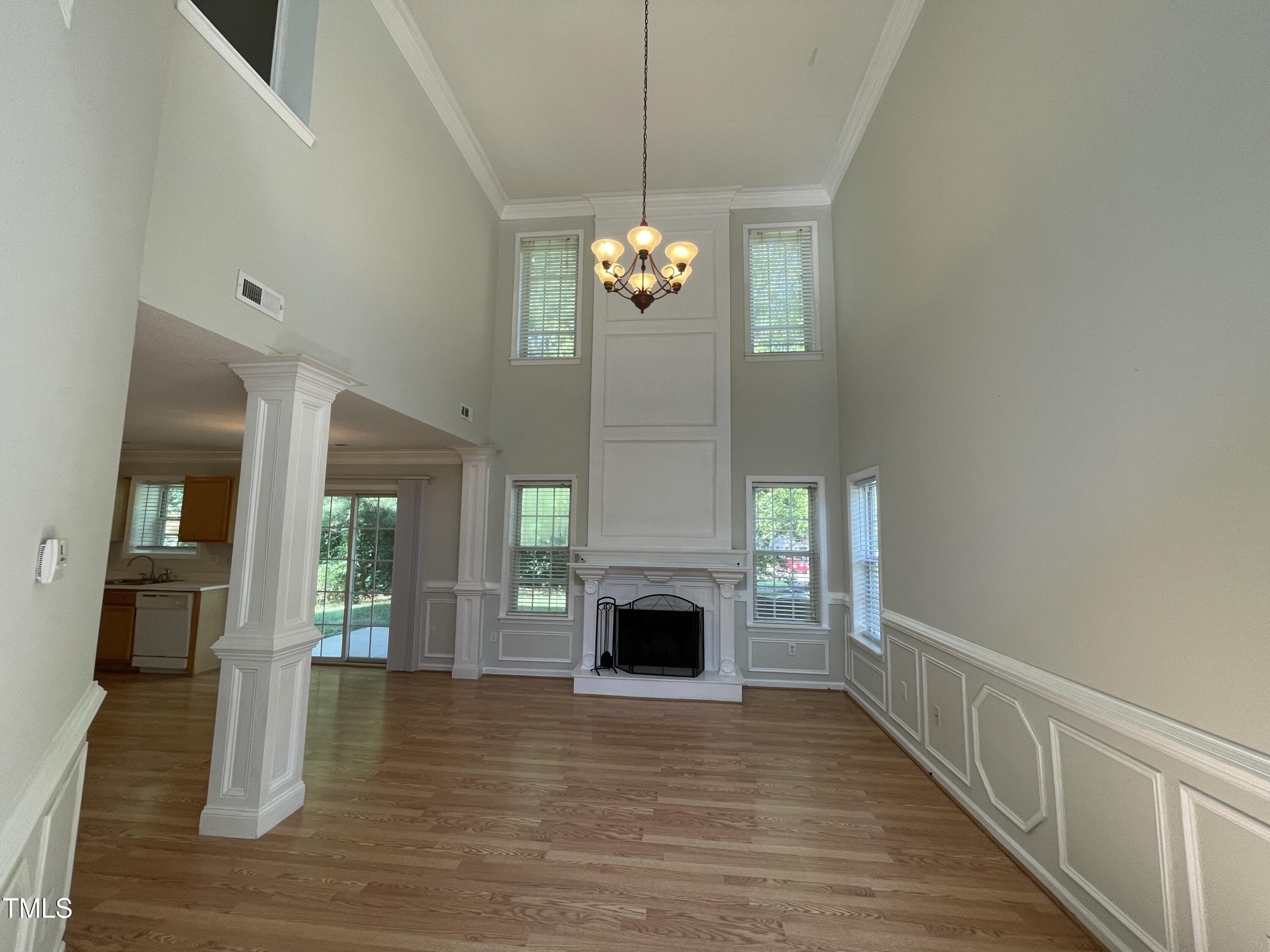 300 Firefly Road Holly Springs, NC 27540 - Photo 7 of 23 a view of a livingroom with wooden floor and a fireplace