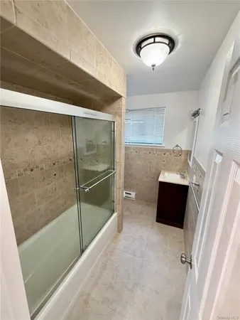 a bathroom with a tub and shower
