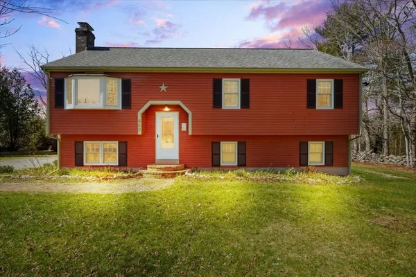 a house that has a big yard in front of it