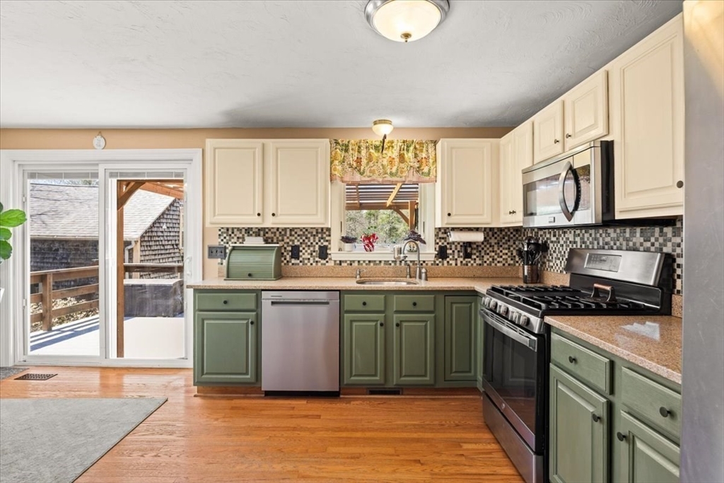 500 Wareham Street Middleboro, MA 02346 - Photo 18 of 42 a kitchen with stainless steel appliances granite countertop a stove a sink and a microwave
