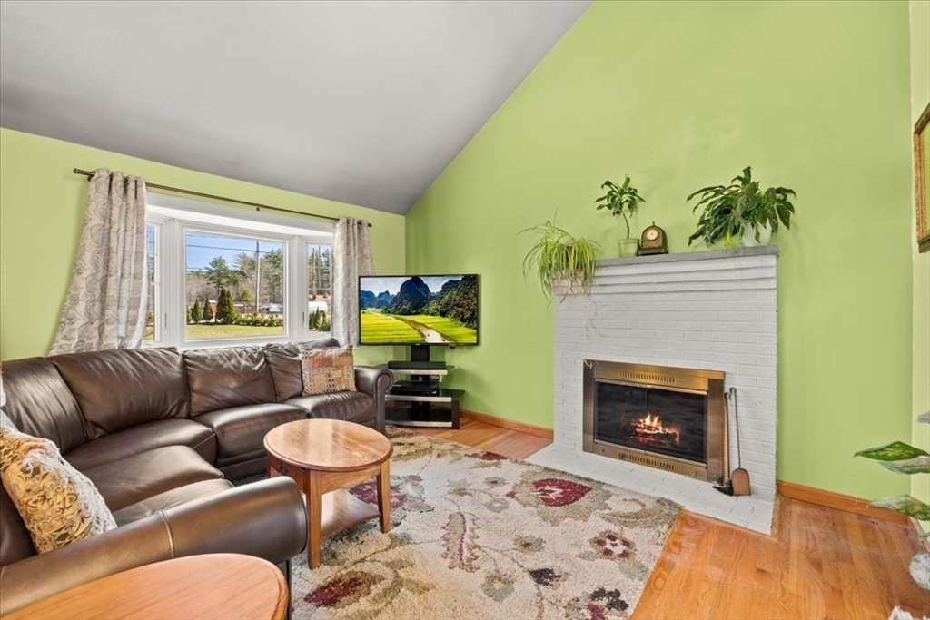 500 Wareham Street Middleboro, MA 02346 - Photo 19 of 42 a living room with furniture a fireplace and a flat screen tv