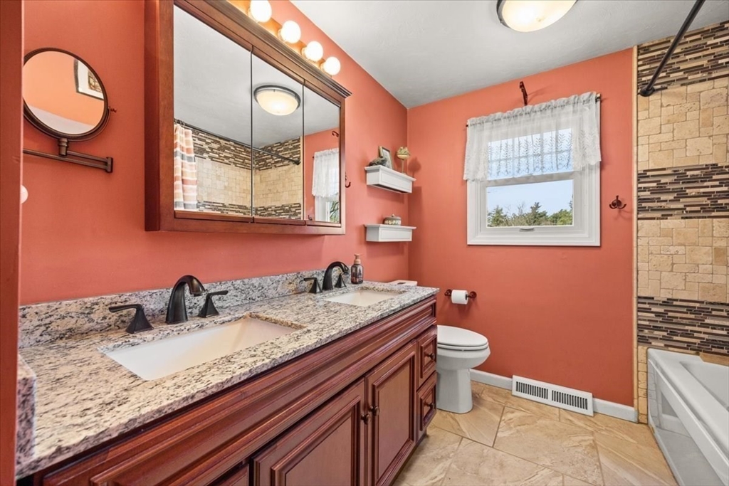 500 Wareham Street Middleboro, MA 02346 - Photo 22 of 42 a bathroom with a granite countertop toilet sink and mirror