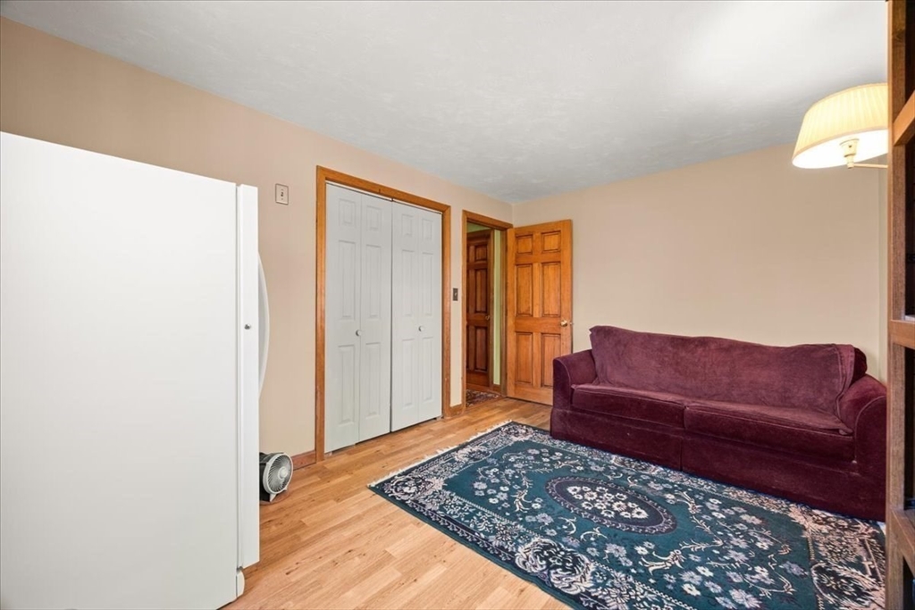500 Wareham Street Middleboro, MA 02346 - Photo 27 of 42 a living room with furniture and a rug