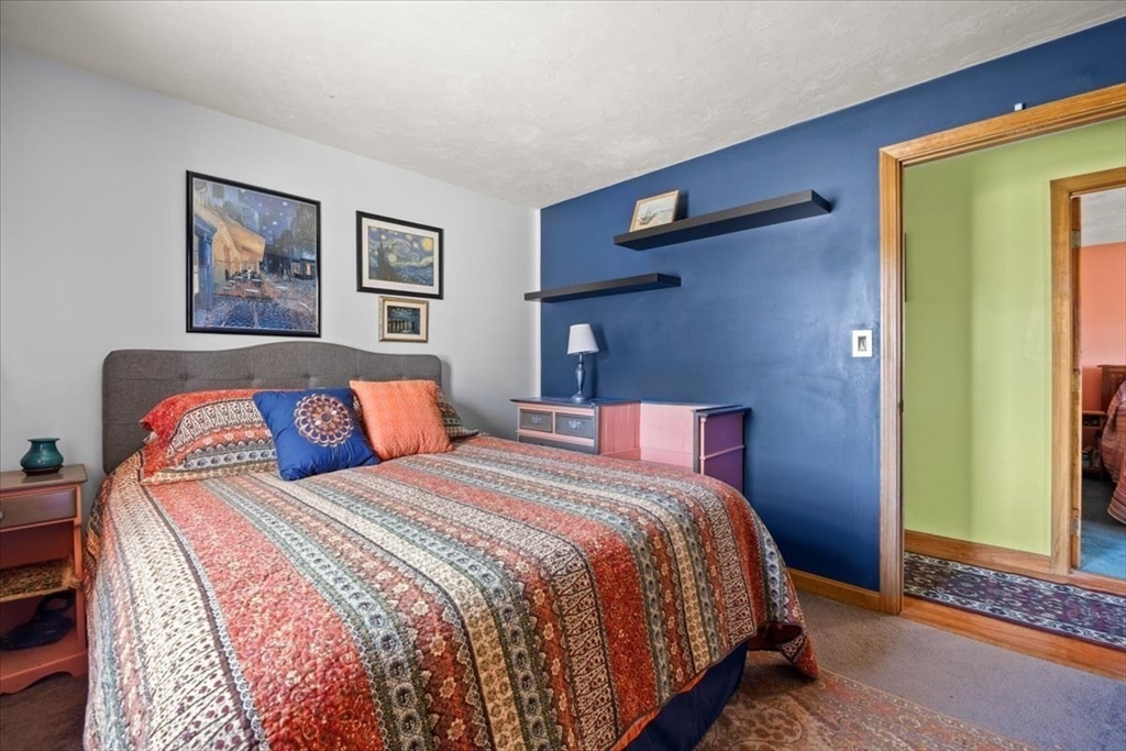 500 Wareham Street Middleboro, MA 02346 - Photo 30 of 42 a bedroom with a bed and painting on the wall