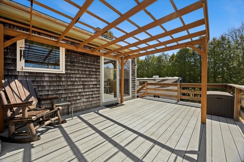 500 Wareham Street Middleboro, MA 02346 - Photo 8 of 42 a view of a patio with table and chairs with wooden floor and fence