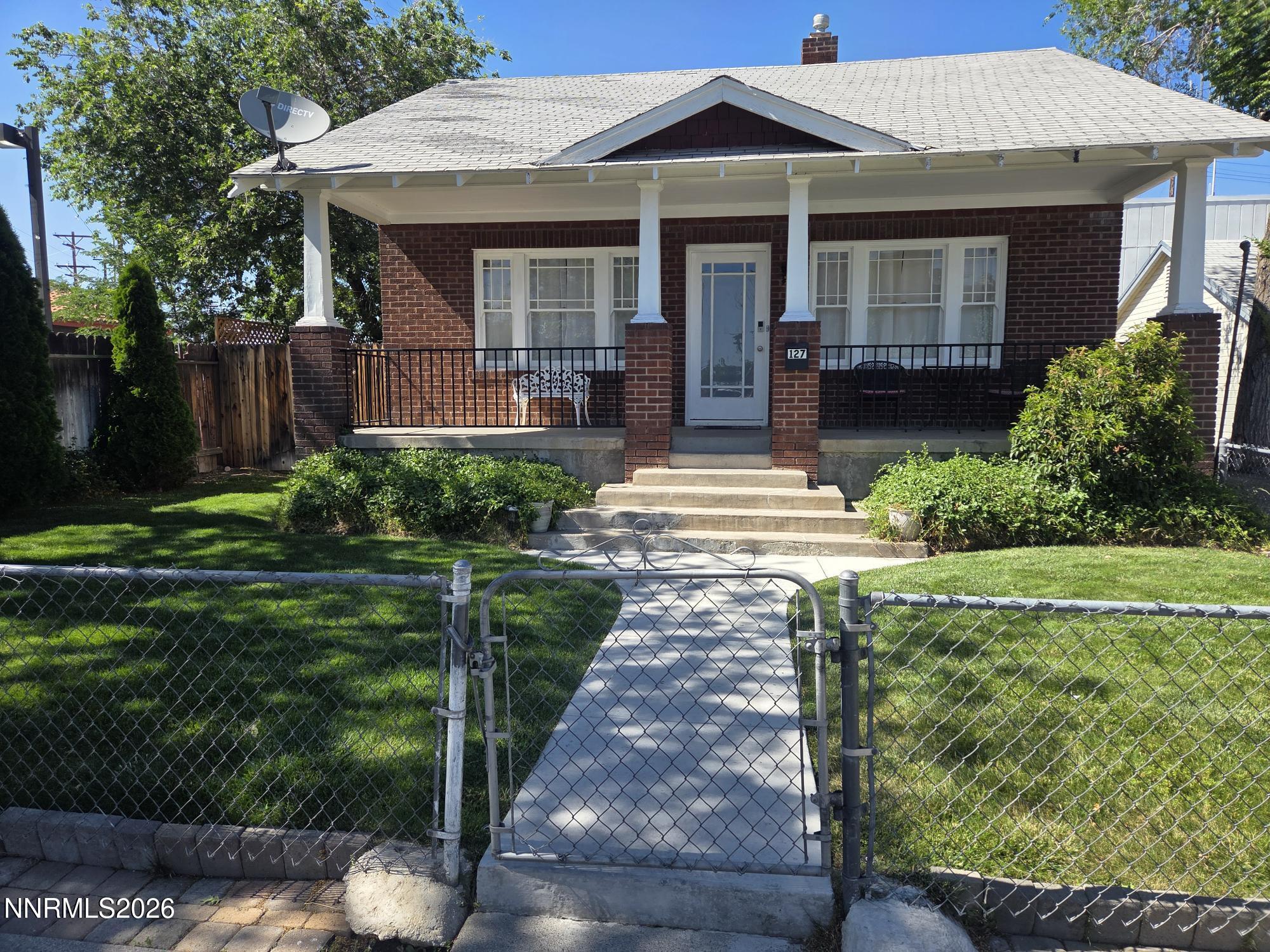 127 East Pueblo Street Reno, NV 89502 - Photo 1 of 16 a front view of a house with garden