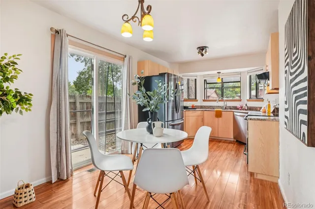 a bed sitting in a bedroom next to a lamp