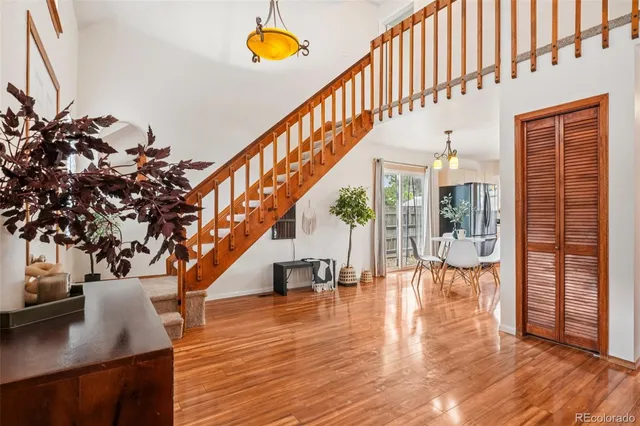 a kitchen with stainless steel appliances granite countertop a refrigerator stove top oven a sink and dishwasher