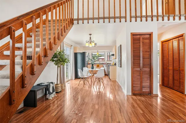 a kitchen with granite countertop a sink a counter top space appliances and cabinets