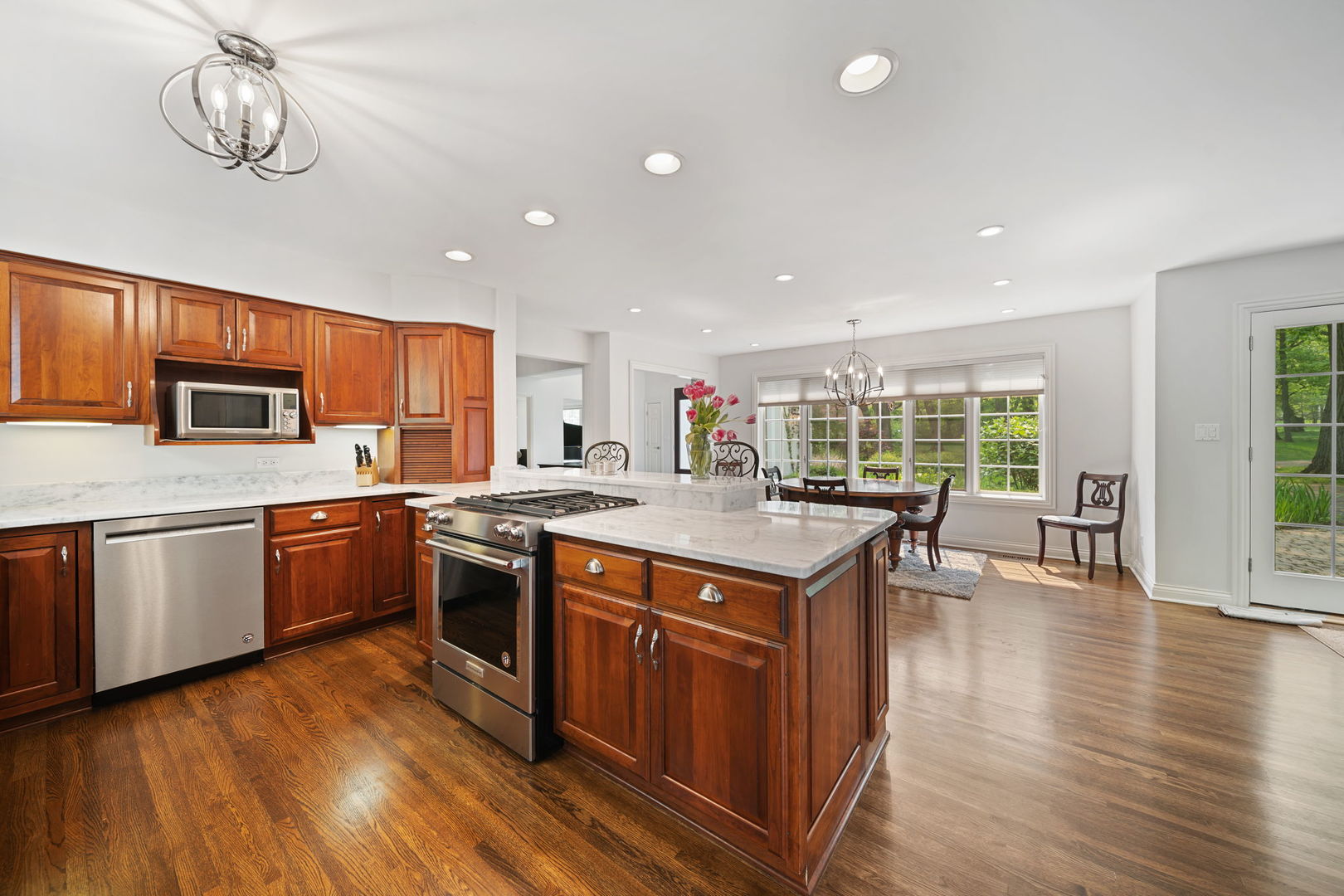7-n751 Sayer Road Bartlett, IL 60103 - Photo 13 of 30 a kitchen with stainless steel appliances granite countertop a stove and cabinets