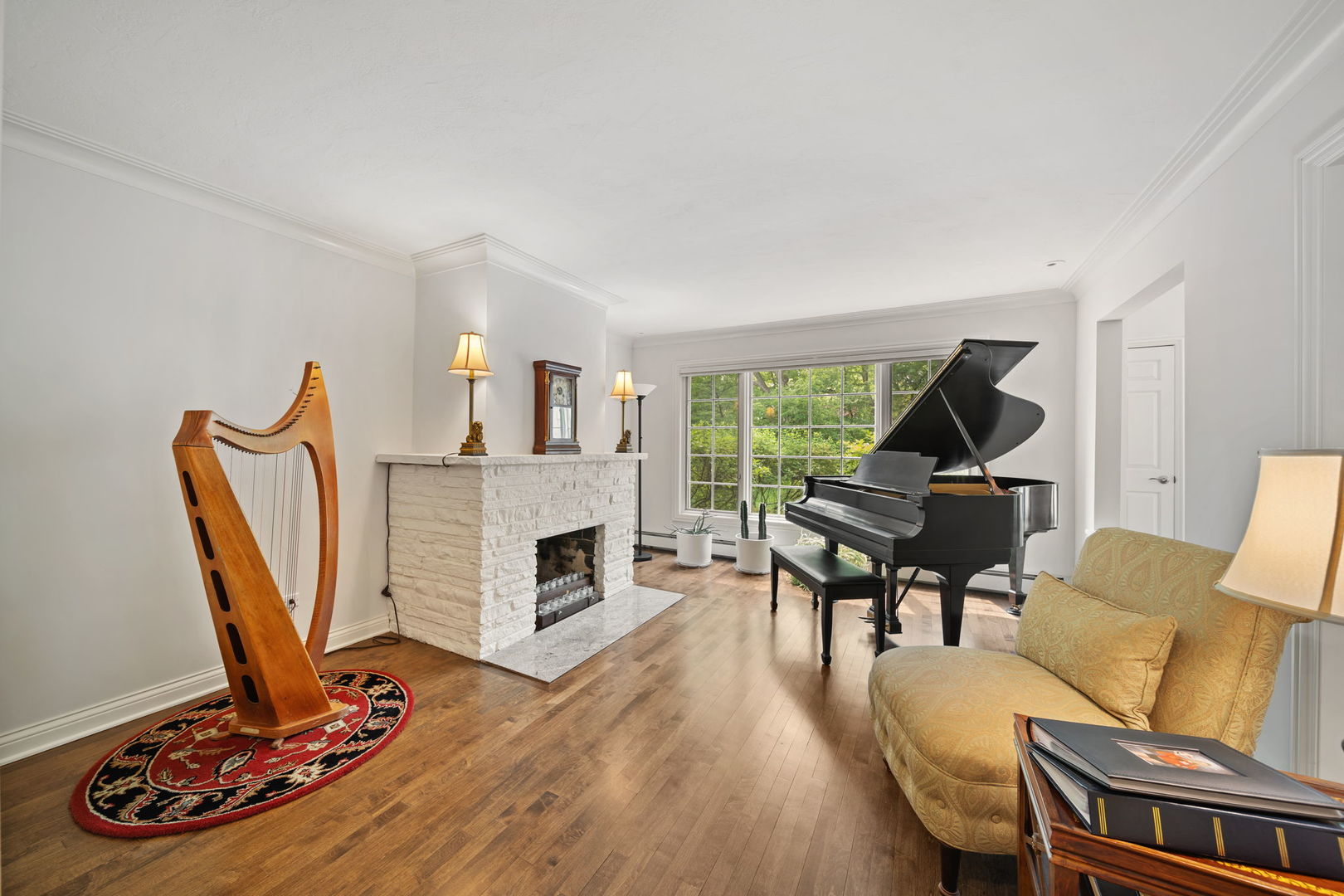 7-n751 Sayer Road Bartlett, IL 60103 - Photo 15 of 30 a living room with furniture a piano and a fireplace