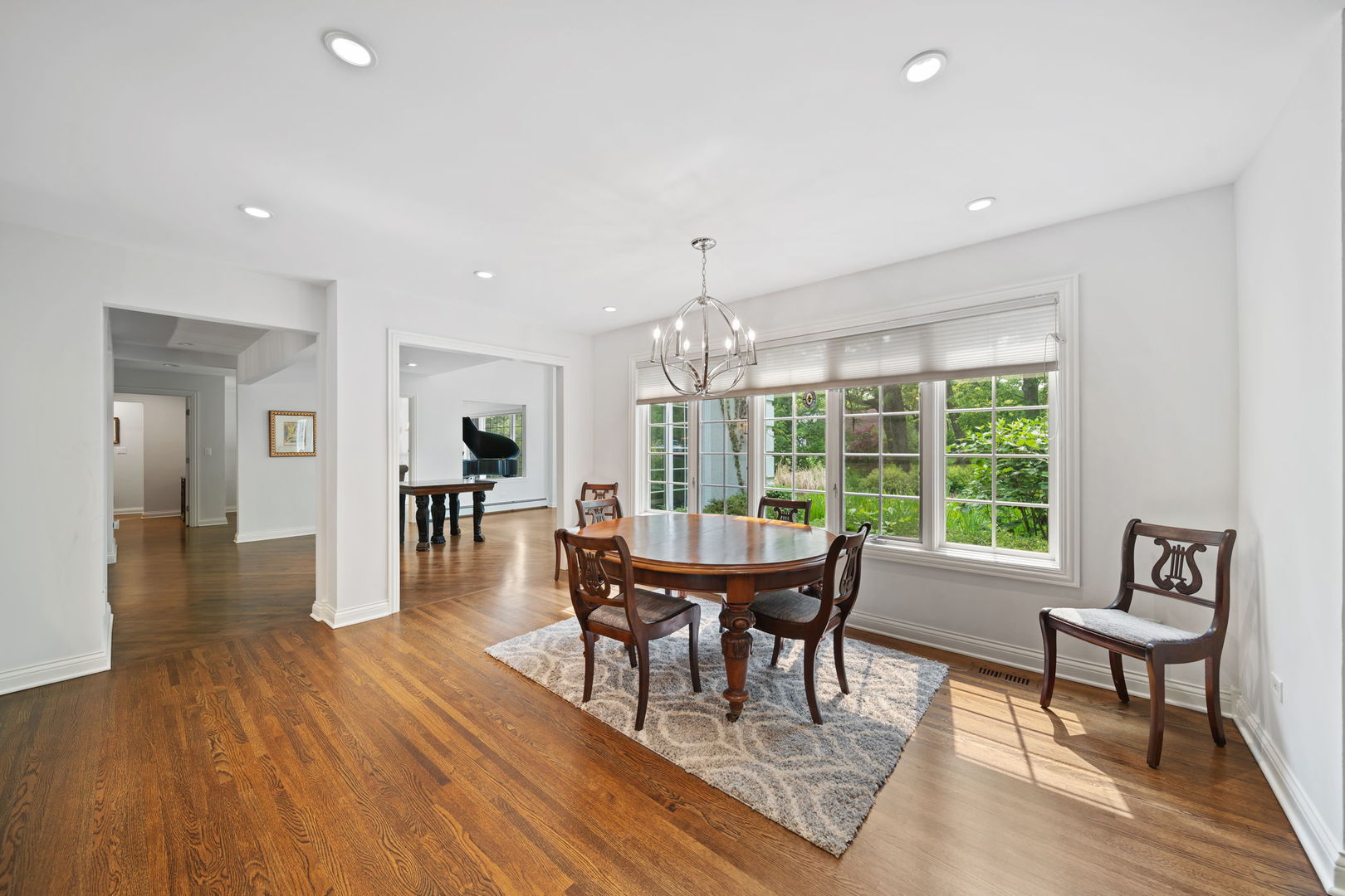 7-n751 Sayer Road Bartlett, IL 60103 - Photo 16 of 30 a view of a dining room with furniture window and wooden floor