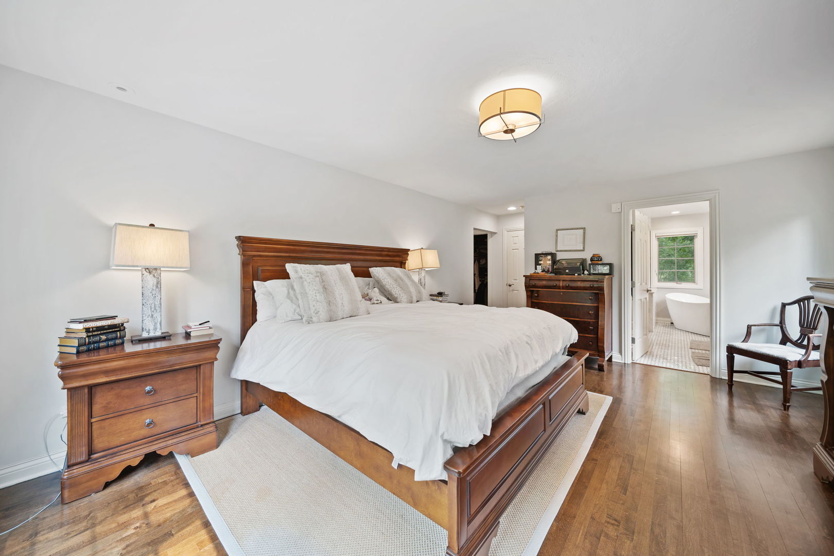 7-n751 Sayer Road Bartlett, IL 60103 - Photo 20 of 30 a bed room with a bed and a lamp