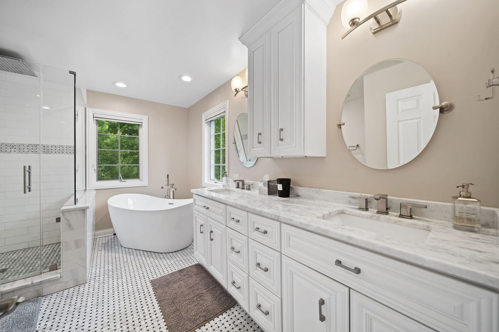 7-n751 Sayer Road Bartlett, IL 60103 - Photo 21 of 30 a spacious bathroom with a double vanity sink a mirror and a bathtub