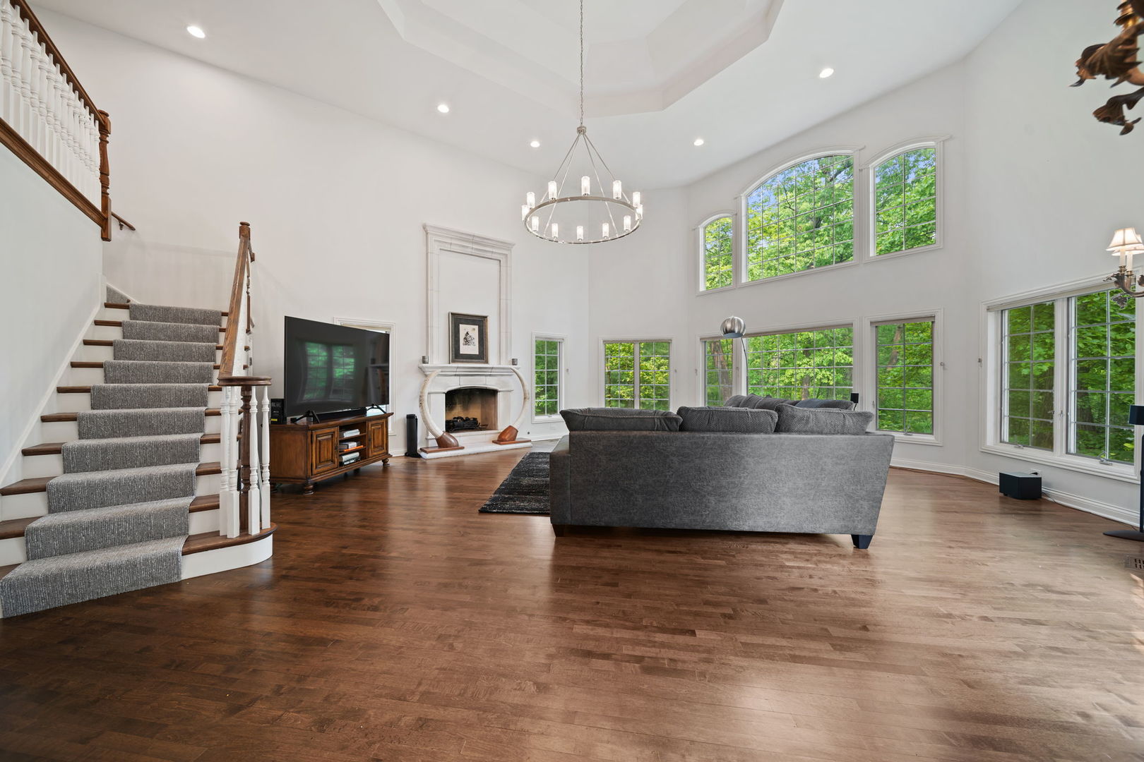 7-n751 Sayer Road Bartlett, IL 60103 - Photo 8 of 30 a living room with fireplace furniture and a large window
