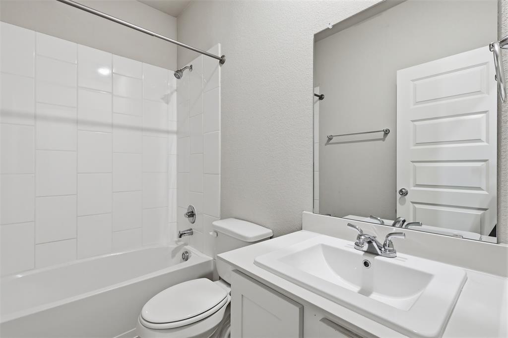 2629 Green River Road Royse City, TX 75189 - Photo 5 of 18 a bathroom with a sink toilet and shower