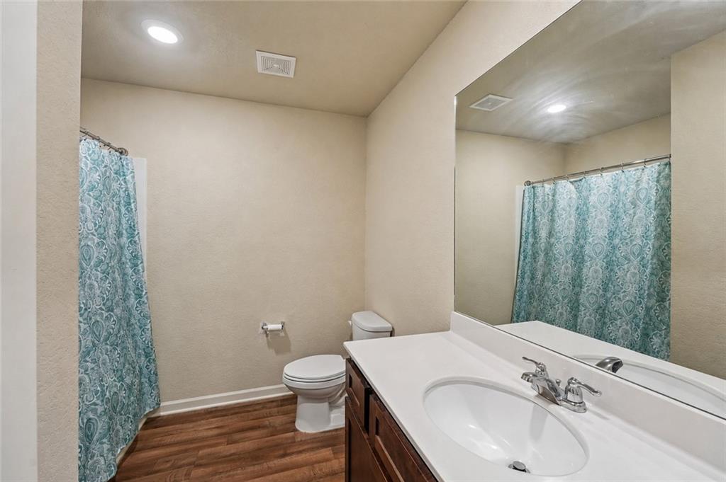 10933 Wheeler Trace Hampton, GA 30228 - Photo 13 of 22 a bathroom with a sink toilet and shower