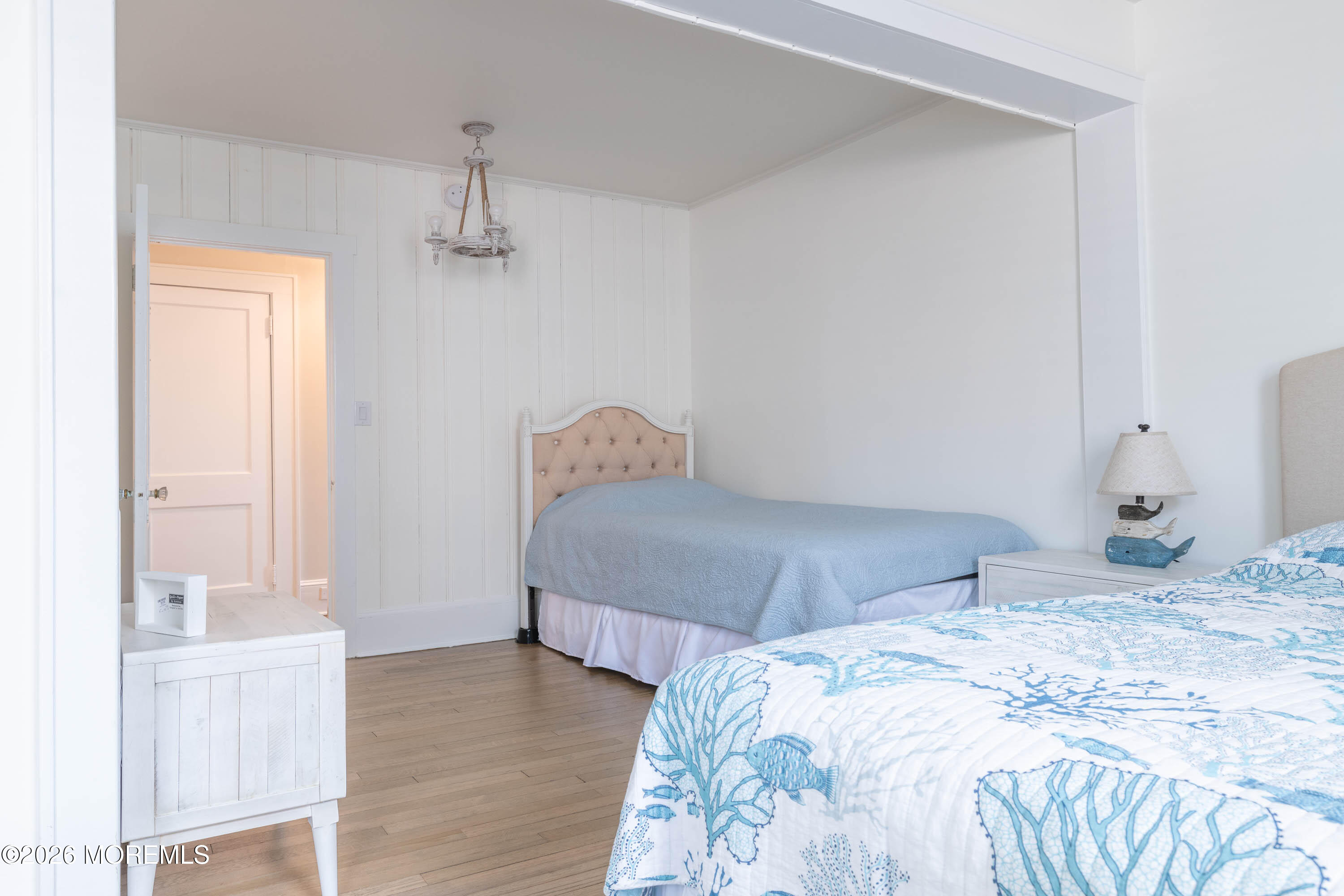 2 Via Ripa, Unit 1 Sea Bright, NJ 07760 - Photo 14 of 38 a bedroom with a bed and wooden floor