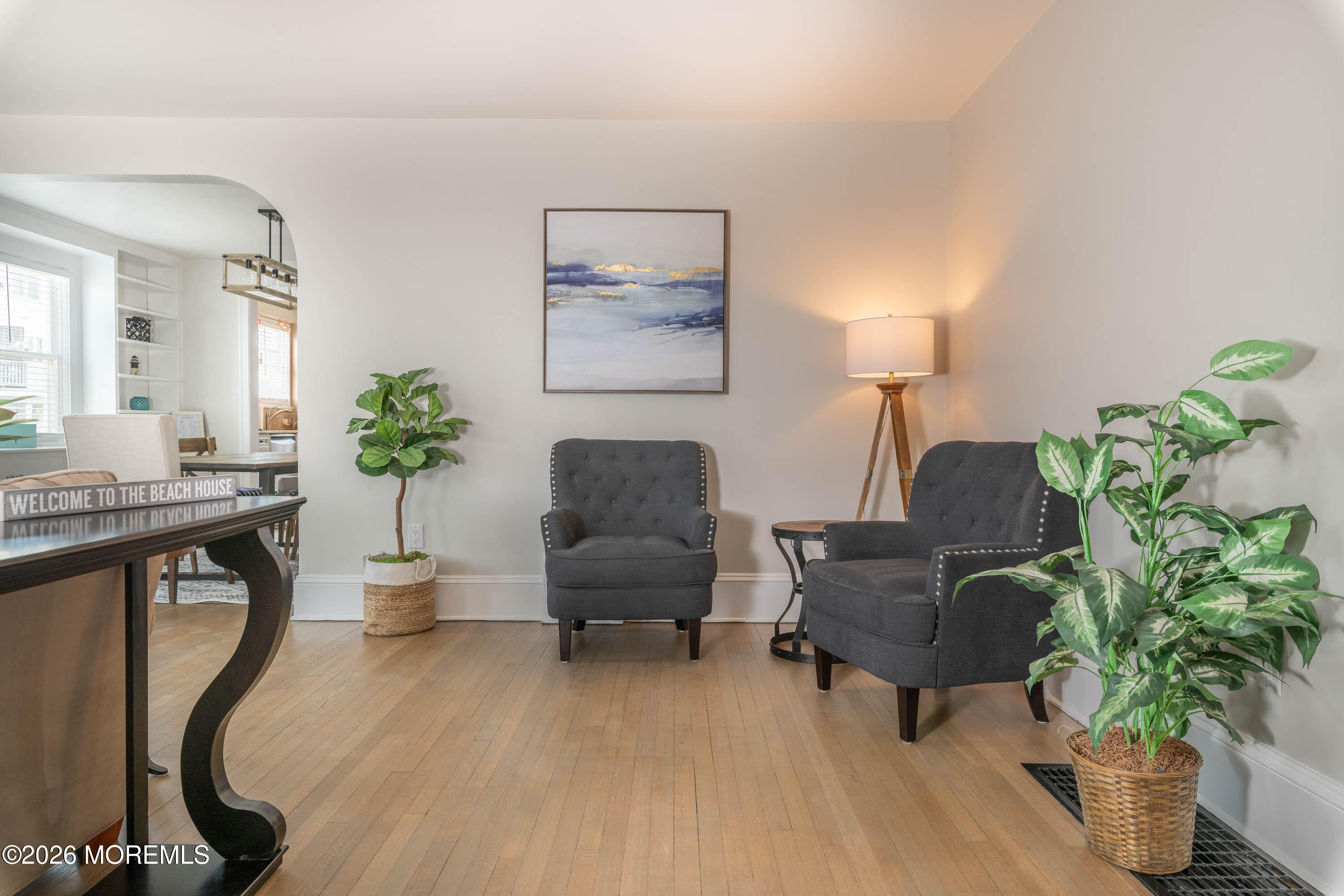 2 Via Ripa, Unit 1 Sea Bright, NJ 07760 - Photo 16 of 38 a living room with furniture potted plant and a lamp