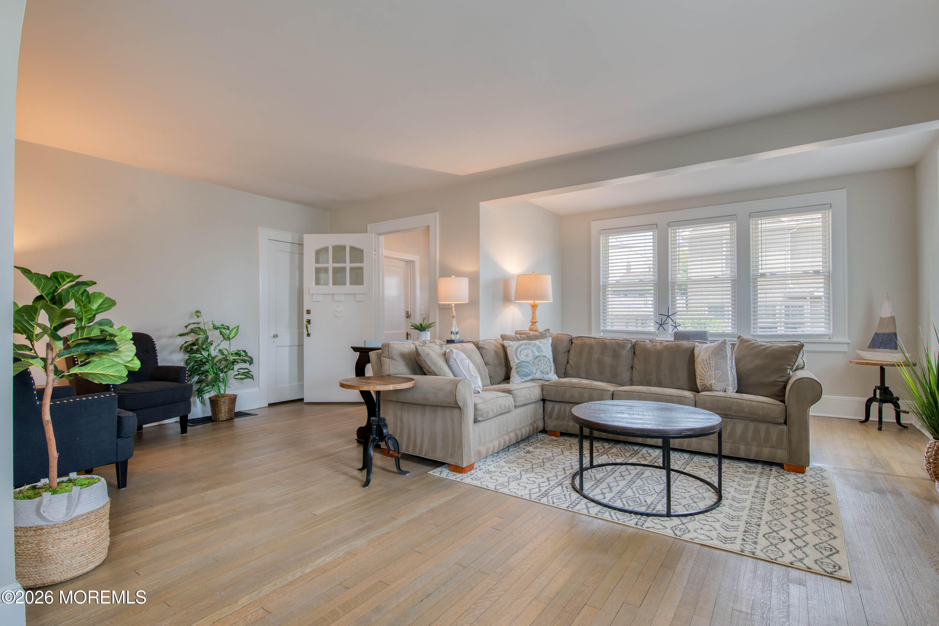 2 Via Ripa, Unit 1 Sea Bright, NJ 07760 - Photo 17 of 38 a living room with furniture and a potted plant