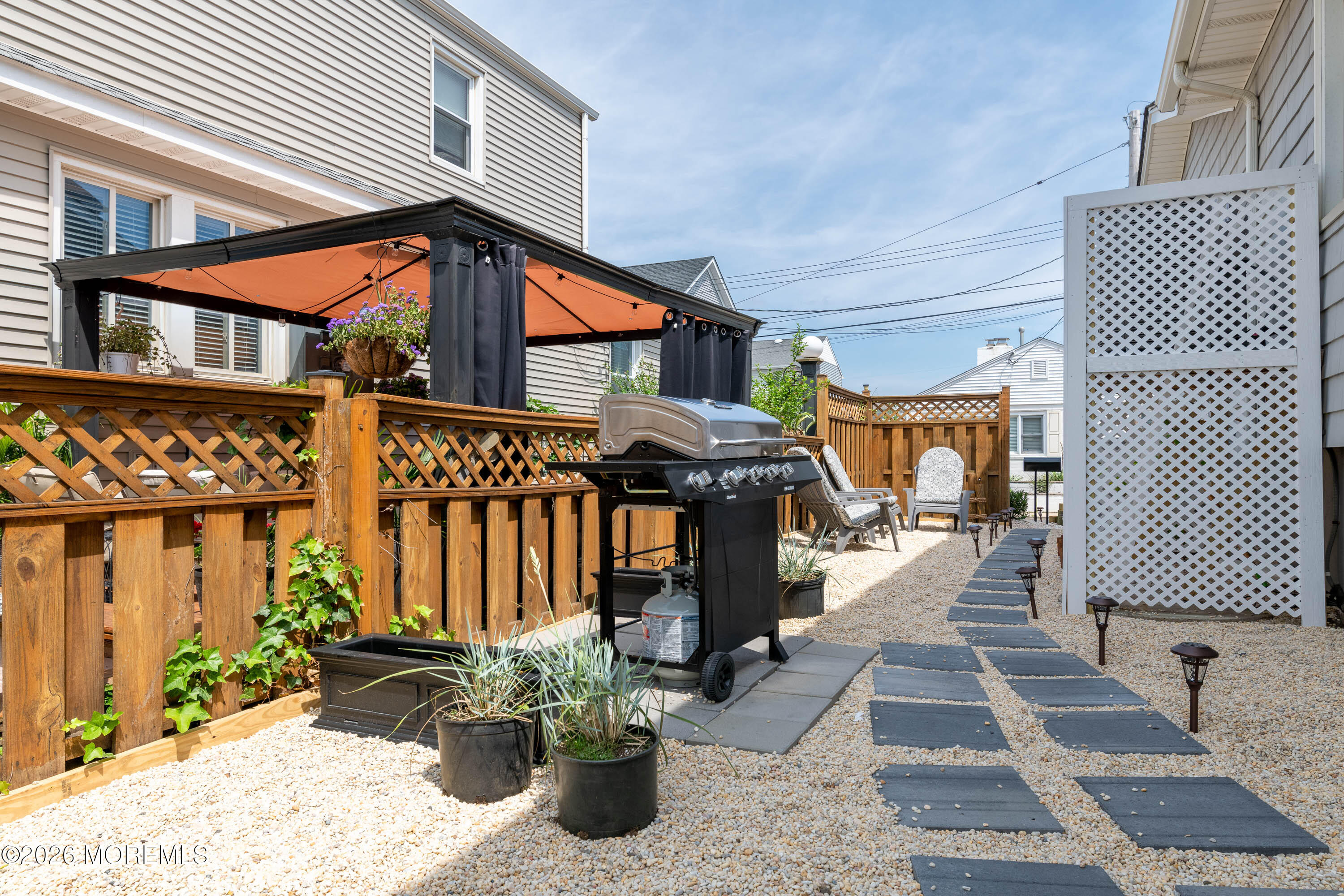 2 Via Ripa, Unit 1 Sea Bright, NJ 07760 - Photo 26 of 38 a front view of a house with outdoor seating