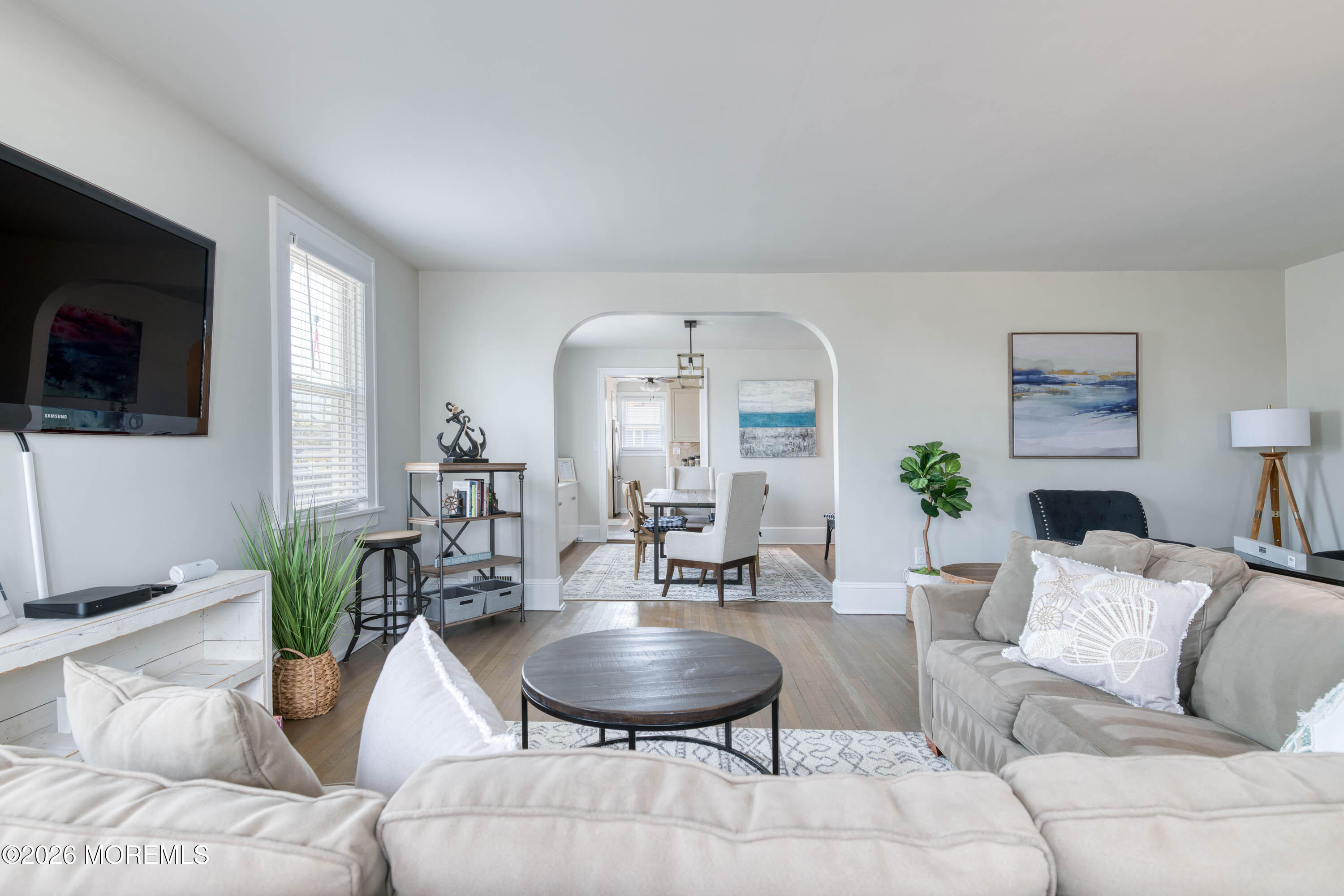 2 Via Ripa, Unit 1 Sea Bright, NJ 07760 - Photo 3 of 38 a living room with furniture and a flat screen tv